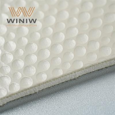 Grip-Enhanced Faux Leather for Professional Footballs